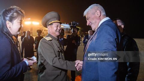 Russia's Minister of Internal Affairs Vladimir Kolokoltsev (R) is greeted by North Korea's Minister of Public Security Pang Tu-sop after his arrival at Pyongyang International Airport on April 20, 2026. (Photo by KIM Won Jin / AFP via Getty Images)