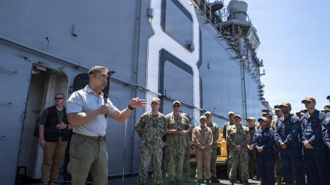 Acting Secretary of the Navy Hung Cao speaks to the crew of Wasp-class amphibious assault ship USS Makin Island during an all-hands call on the flight deck on August 7, 2026, in San Diego, California. (US Navy)