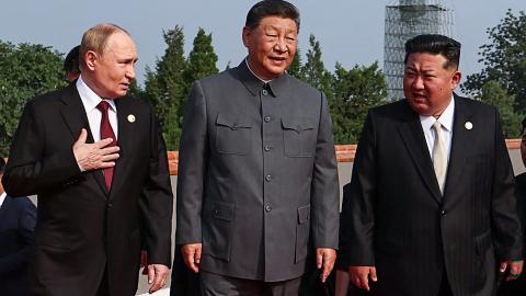 Russia’s President Vladimir Putin walks with China’s President Xi Jinping and North Korea’s leader Kim Jong Un before a military parade in Beijing’s Tiananmen Square on September 3, 2025. (Getty Images)