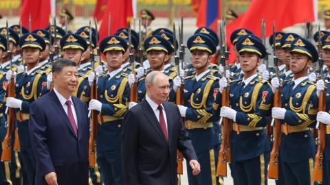 Russian President Vladimir Putin and Chinese President Xi Jinping inspect an honor guard during a welcoming ceremony at the Great Hall of the People on May 20, 2026, in Beijing, China. (Getty Images)