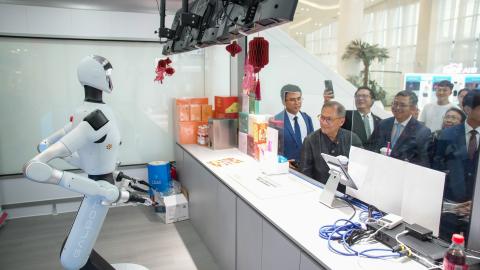 Diplomatic envoys of ASEAN countries to China watch an intelligent robot during a visit to the China-ASEAN AI Application Center on July 22, 2026, in Nanning, China. (Getty Images)