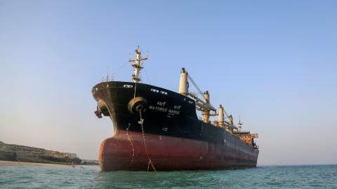 A bulk carrier that was struck by a missile near the Strait of Hormuz during attacks launched by the United States and Israel against Iran is seen stranded off the coast of Qeshm Island, Iran, on September 11, 2026. (Getty Images)