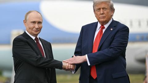 US President Donald Trump greets Russian President Vladimir Putin on the tarmac after they arrived at Joint Base Elmendorf-Richardson in Anchorage, Alaska, on August 15, 2025. (Getty Images)