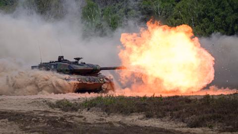 A Leopard 2A6 tank fires during a demonstration as German Chancellor Friedrich Merz visited troops at the Bundeswehr’s barracks in Munster, Germany, on April 30, 2026. (Getty Images)