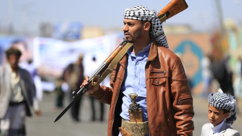 A fighter loyal to the Houthi authorities, takes part in a rally to recruit more fighters, in Sanaa on October 7, 2026. (Getty Images)