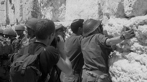 At the end of the Six Day War, Israeli soldiers hug and kiss the stones of the Western Wall, Old City of Jerusalem, Israel, June 11, 1967 (Dan Porges/Getty Images)