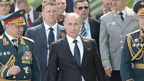 Russian President Vladimir Putin at the Tomb of the Unknown Soldier in Moscow on May 9, 2015 (RIA Novosti via Getty Images)