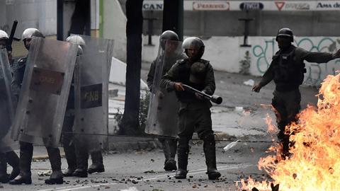 Members of the Bolivarian National Guard clash with anti-government protesters in Caracas, Venezuela on July 20, 2017 (Carlos Becerra/Anadolu Agency/Getty Images)