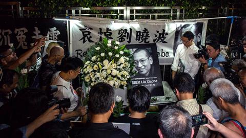 People mourn the death of Liu Xiaobo outside the Chinese liaison office in Hong Kong, July 13, 2017 (Billy H.C. Kwok/Getty Images)