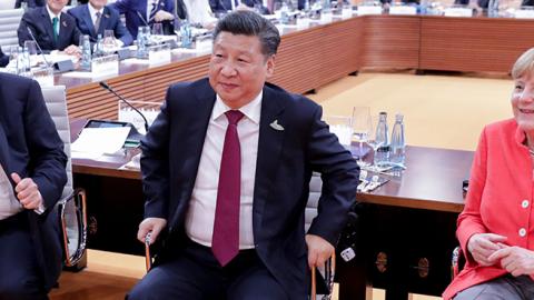 U.S. President Trump, Chinese President Jinping, and German Chancellor Merkel at the G20 meeting in Hamburg, July 7, 2017 (PHILIPPE WOJAZER/AFP/Getty Images)