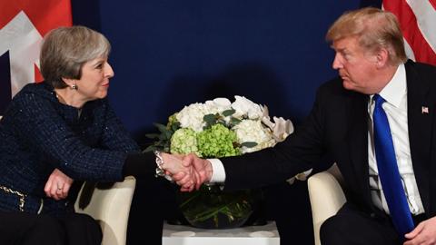 US President Donald Trump and Britain's Prime Minister Theresa May shake hands during a bilateral meeting on the sidelines of the World Economic Forum annual meeting in Davos, eastern Switzerland, January 25, 2018.