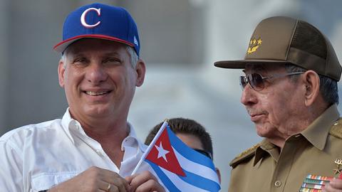 Cuban President Miguel Diaz-Canel (L) and former president Raul Castro attend the May Day rally at Revolution Square in Havana on May 1, 2018. 