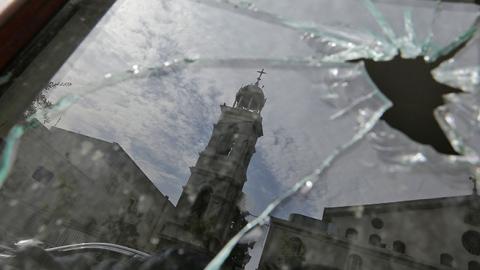 Greek Orthodox Church in Damascus reflected in window broken by rebel mortar bombardment, February 8, 2018 