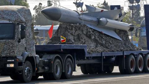 An Iranian military truck carries missiles during a parade on the occasion of the country's annual army day, April 18, 2018 