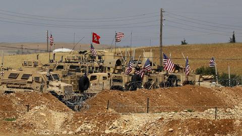 Vehicles belonging to US-backed coalition forces in the northern Syrian town of Manbij, May 8, 2018 (DELIL SOULEIMAN/AFP/Getty Images)