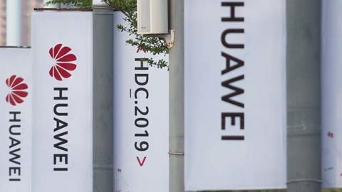 Banners with the Huawei logo are seen outside the venue where the telecom giant unveiled its new HarmonyOS operating system in Dongguan, Guangdong province. (Getty Image)