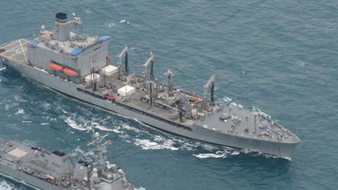 The guided-missile destroyer USS Sampson, bottom, and underway replenishment oiler USNS Pecos conduct a replenishment at sea. (U.S. Navy)