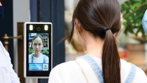 A person gets checked by an automated AI temperature screening system outside a restaurant as the city continues Phase 4 of re-opening following restrictions imposed to slow the spread of coronavirus on August 22, 2020, in New York City. (Getty Images)