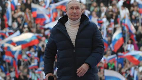 Russian President Vladimir Putin attends a concert marking the eighth anniversary of Russia's annexation of Crimea at the Luzhniki stadium in Moscow on March 18, 2022. (Getty Images)