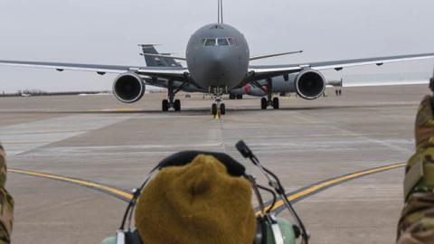 An Aircraft Maintenance Squadron crew chief marshals the KC-46A Pegasus on the flight line on February 21, 2019, at McConnell Air Force Base, Wichita, Kansas. (Alexi Myrick/US Air Force)