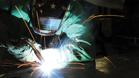 Staff Sgt. Neil Oltmer uses metallic inert gas welding to build a mounting plate on March 18, 2014, at McConnell Air Force Base, Kansas. (US Air Force photo/Airman 1st Class David Bernal Del Agua)