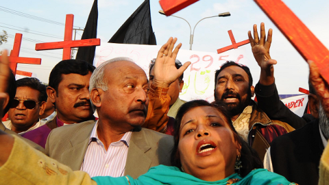 Members of the Pakistan Christian Democratic alliance march during a protest in Lahore on December 25, 2010, in support of Asia Bibi (Arif Ali/AFP/Getty Images)