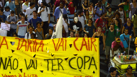 Demonstrators march during a protest against a rise on public bus fares and the costs of the Brazil 2014 FIFA World Cup, Rio de Janeiro, Brazil, February 13, 2014. (CHRISTOPHE SIMON/AFP/Getty Images)