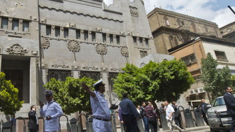 Security forces patrol as people arrive at the Adly Synagogue for the funeral of the president of the Egyptian Jewish Community Carmen Weinstein on April 18, 2013 in Cairo, Egypt (KHALED DESOUKI/AFP/Getty Images)