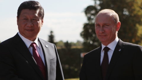 Russian President Vladimir Putin and President of the People's Republic of China Xi Jinping shake hands at the meeting of the BRICS delegation heads, in St. Petersburg, Russia, September 5, 2013. (Igor Russak/Host Photo Agency via Getty Images)