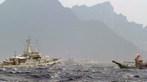 A Taiwan fishing boat (R) is blocked by a Japan Coast Guard (L) vessel near the disputed Diaoyu / Senkaku islands in the East China Sea on September 25, 2012. (SAM YEH/AFP/GettyImages)