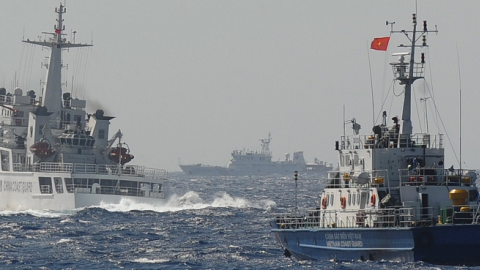 A Chinese coast guard vessel (L) followed by a Vietnamese coast guard ship (R) near the area of China's oil drilling rig in disputed waters in the South China Sea, May 14, 2014. (HOANG DINH NAM/AFP/Getty Images)