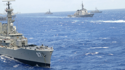 Naval ships from multiple nations steam in formation during the RIMPAC excercise operations near Oahu, Hawaii, July 11, 2002. (Phil Mislinski/Getty Images)