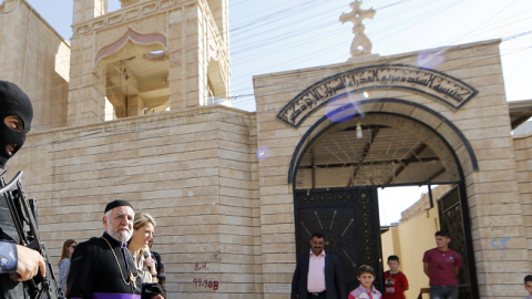 An Iraqi security officer stands guard outside the Church of the Virgin Mary in Bartala, June 15, 2012. (KARIM SAHIB/AFP/Getty Images)