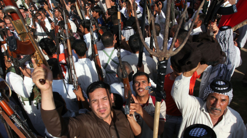 Iraqi Shiite tribesmen gather to join Iraqi security forces in the fight against Jihadist militants, Najaf, Iraq, June 16, 2014. (HAIDAR HAMDANI/AFP/Getty Images)