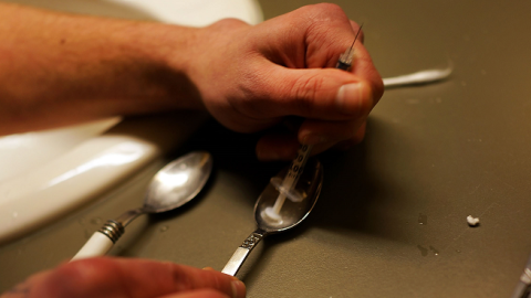 Drugs are prepared to shoot intravenously by a user addicted to heroin on February 6, 2014 in St. Johnsbury, Vermont. (Spencer Platt/Getty Images)