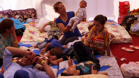 An Iraqi Christian family live in a tent at a displacement camp for Christians after having to flee their district on June 26, 2014 in Erbil, Iraq.(Spencer Platt/Getty Images)