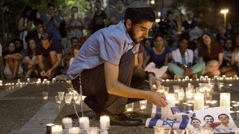 Israelis mourn and light candles in Rabin Square in Tel Aviv on June 30, 2014 after the announce that the bodies of the three missing Israeli teenagers were found. (OREN ZIV/AFP/Getty Images)