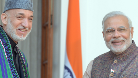 India's Prime Minister Narendra Modi (R) shakes hands with Afghanistan President Hamid Karzai during a meeting in New Delhi on May 27, 2014.(RAVEENDRAN/AFP/Getty Images)