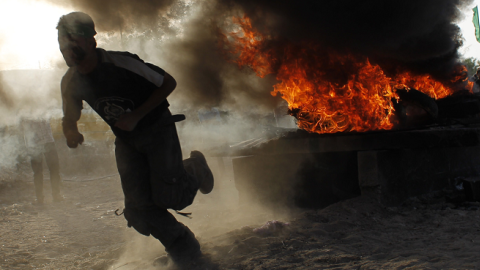 A Palestinian youth take part in military-inspired exercises organised by the Islamist movement Hamas on June 19, 2014 in Rafah, southern Gaza Strip. (SAID KHATIB/AFP/Getty Images)