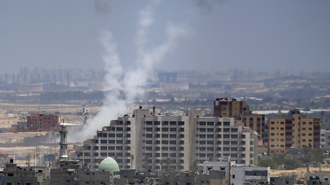 Smoke from rockets fired from Gaza City are seen after being launched toward Israel, on July 15, 2014.(THOMAS COEX/AFP/Getty Images)