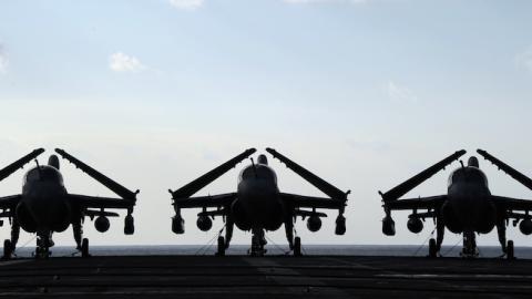Three electronic warfare aircrafts, EA-6B 'Prowler', are parked on the flight deck of US aircraft carrier USS George Washington, December 10, 2010. (TOSHIFUMI KITAMURA/AFP/Getty Images)
