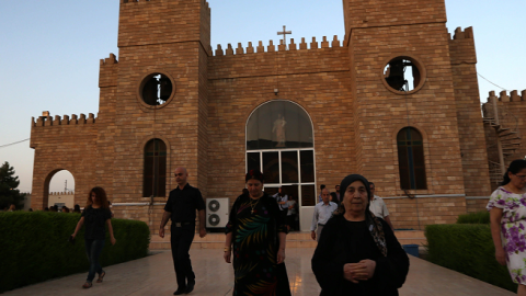 Iraqi Christians leave Saint-Joseph church after a mass on July 20, 2014 in Arbil. (SAFIN HAMED/AFP/Getty Images)
