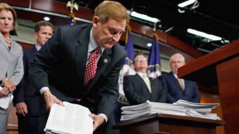 House Financial Services Committee Chairman Spencer Bachus (R-AL) (C) lifts copies of the Dodd-Frank financial reform bill, September 8, 2011 in Washington, DC. (Chip Somodevilla/Getty Images)