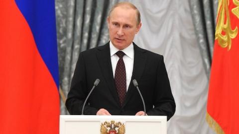 Russia's President Vladimir Putin speaks during an awarding ceremony in the Kremlin in Moscow, on July 31, 2014. (MIKHAIL KLIMENTYEV/AFP/Getty Images)