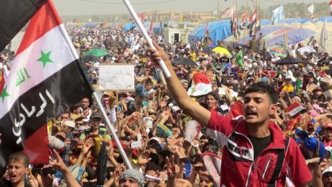Iraqi demonstrators shout slogans during an anti-government protest in the western city of Ramadi on March 15, 2013. (AZHAR SHALLAL/AFP/Getty Images)