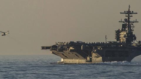 The aircraft carrier USS George H.W. Bush transits the Strait of Hormuz, June 14, 2014. (U.S. Navy photo by Petty Officer 3rd Class Scott Barnes)