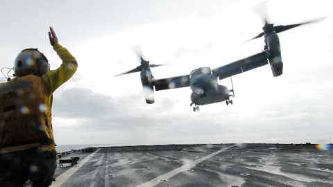 Aviation Boatswain's Mate (Handling) Airman Jennifer L. Confer directs a V-22 Osprey from the USS Ashland (LSD 48), Nov. 22 2013. (U.S. Navy photo by Chief Mass Communication Specialist Allen Onstott/Released)