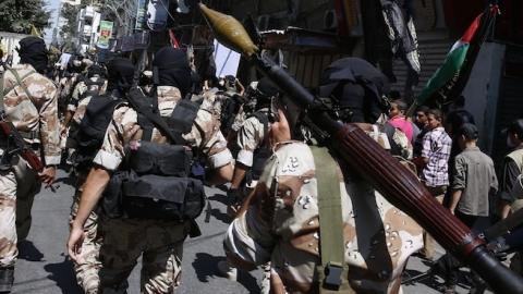 Palestinian Islamic Jihad militants parade down a street in downtown Gaza City on August 29, 2014. (ROBERTO SCHMIDT/AFP/Getty Images)