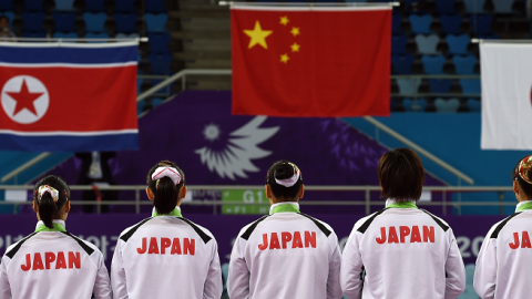 Bronze medalist Japanese team members at the medal ceremony of the 2014 Asian Games in Incheon on September 22, 2014. (INDRANIL MUKHERJEE/AFP/Getty Images)