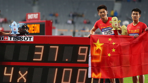 Chen Shiwei, Xie Zhenye, Su Bingtian and Zhang Peimeng of China celebrate claiming the Gold medal in the Men's 4x100m Relay Final of the 2014 Asian Games on October 2, 2014 in Incheon, South Korea. (Brendon Thorne/Getty Images)